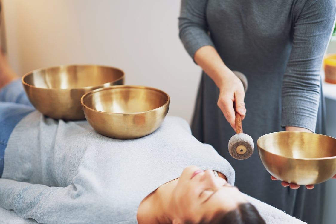 Woman Having a Tibetan Sound Bowl Massage